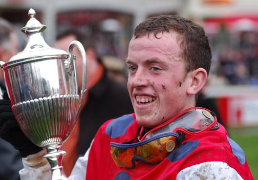Adrian holding the Paddy Power Chase trophy after Cane Brake's win in 2006