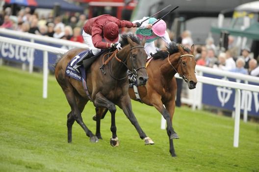 Sariska (left) and Midday fight it out at Epsom