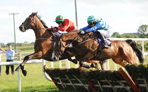 Cyclinder Rattler (near) and Paul Townend jump the last to win from Trptronic and Andrew McNamara