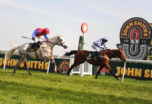 Oscar Whisky pictured winning the Aintree Hurdle last year from Thousand Stars   back in second