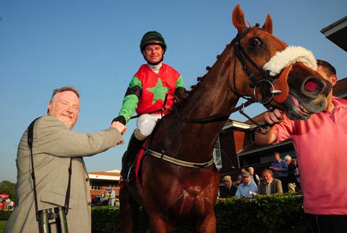 Tommy Treacy and Beachdale Lad are greeted back into the winners enclosure