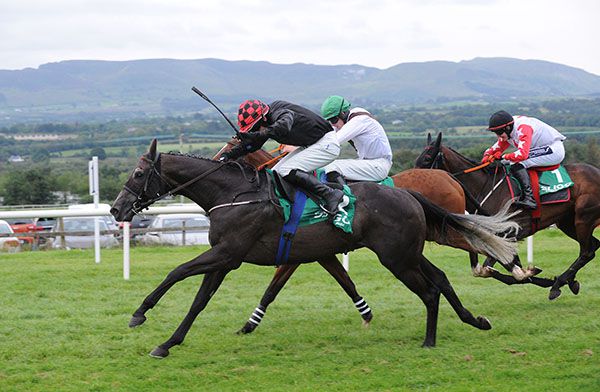 DOLLAR VALUE and Daragh O'Keeffe (near side) win for trainer Tom McCourt.