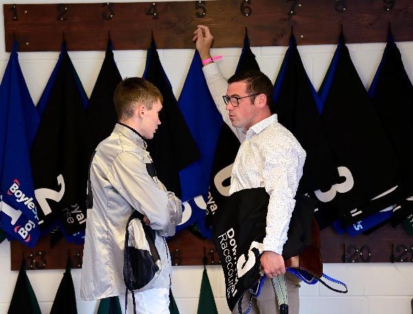 Patrick Magee talking to jockey Sean Bird at Down Royal