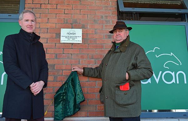 Aidan and former Navan committee chairman Noel Meade unveil a plaque to commemorate 100 years of racing