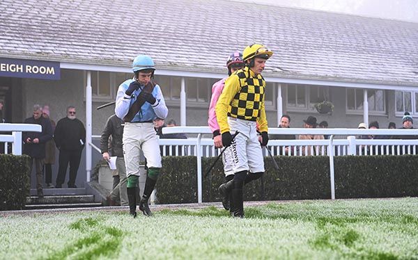 Jockeys heading out to ride in the first and only race held at Naas on Sunday