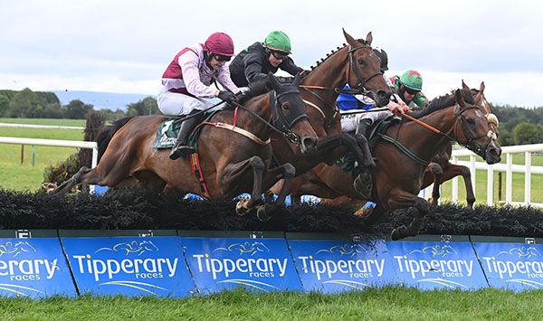 Secrecies Of Stone (centre) and Sean O'Keeffe jumping the last