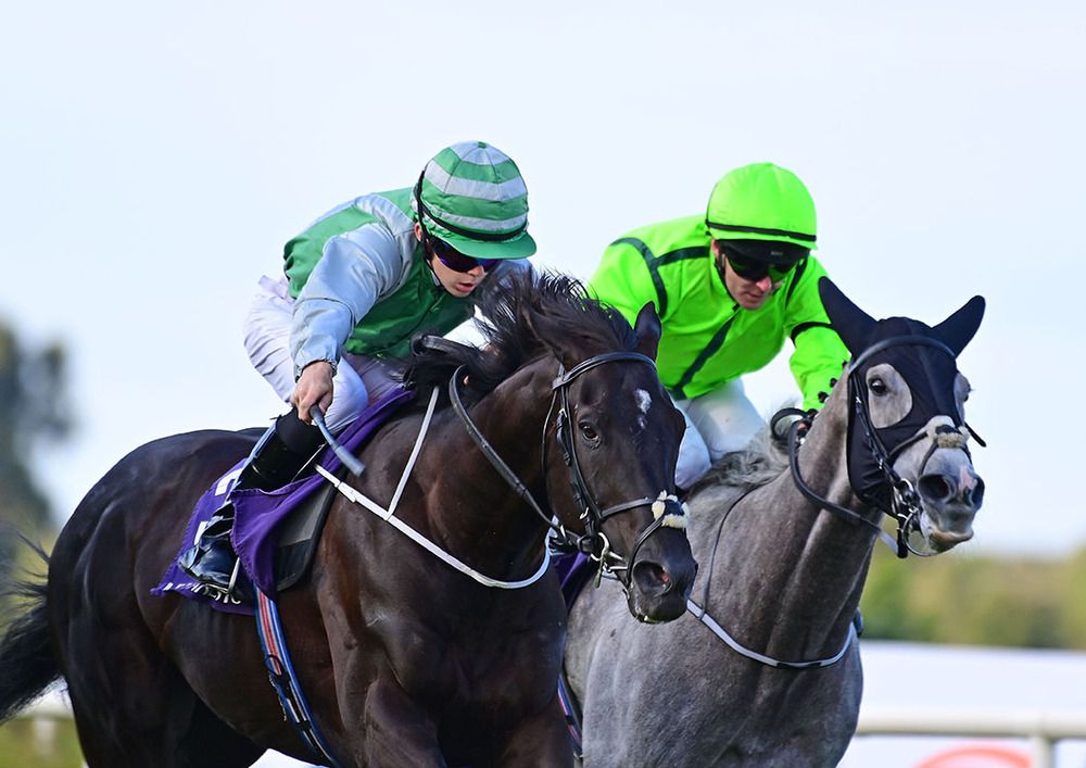 Giuseppe Cassioli, left, wins by half a length