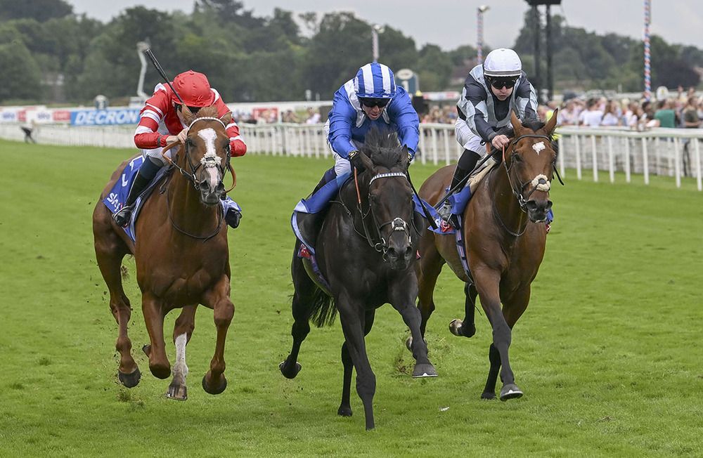 Alflaila and Jim Crowley centre winning the Sky Bet York Stakes