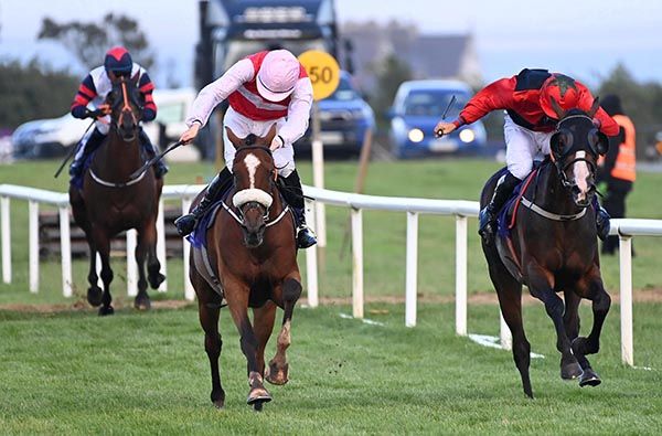 Tuckmill (left) is driven out by Jake Coen to beat Baltinglass Hill