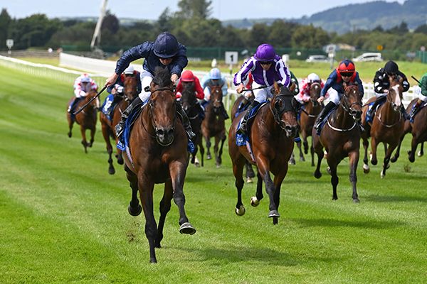 Ides Of March (Ryan Moore) races away from Monumental (Wayne Lordan) and company