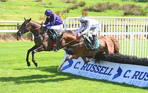 Up And Out and Finn Brickley (far-side) head for victory in race three at Downpatrick