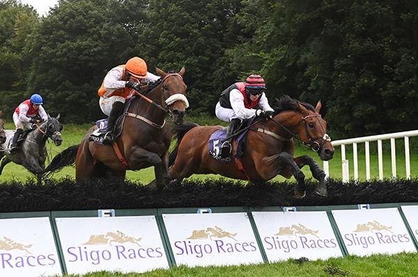  High Honour and John Shinnick (far) jump the last with Verbal Sparring 