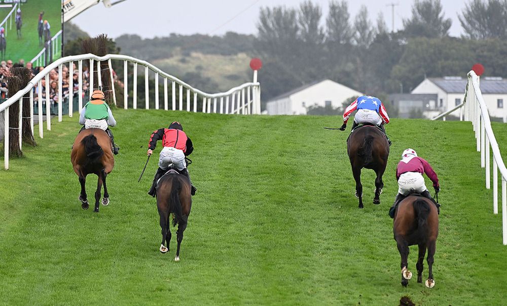 Prairie Dancer, second left, finishes with a flourish to catch Watch The Weather, left 