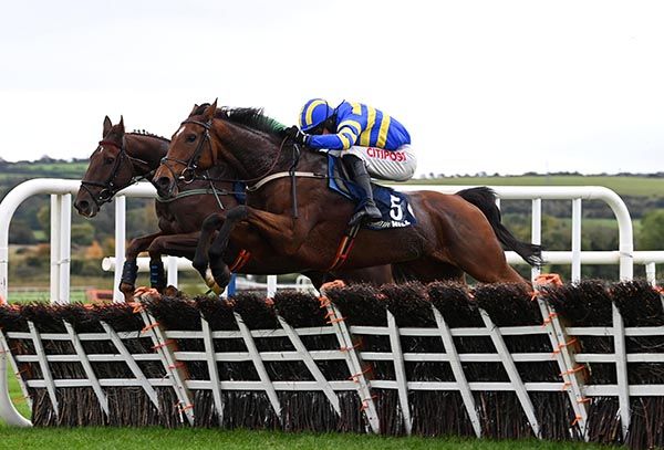 Mister Pink and Danny Mullins (nearest) jump the last alongside Ballysax Hank