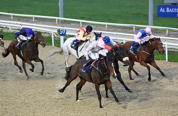 Shaaden (nearest) is ridden out by Billy Lee to beat Jackie Brown (noseband)