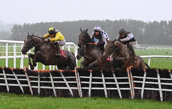 Farmers Lodge (left) and Sean Flanagan jump the last alongside Stormbreaker (left) and Marelly (centre)