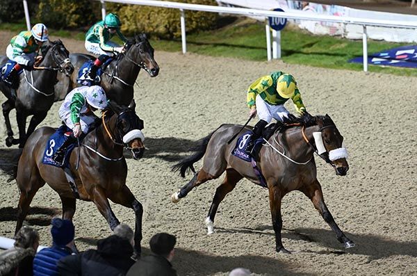 Exquisite Acclaim, right, arriving at the winning post